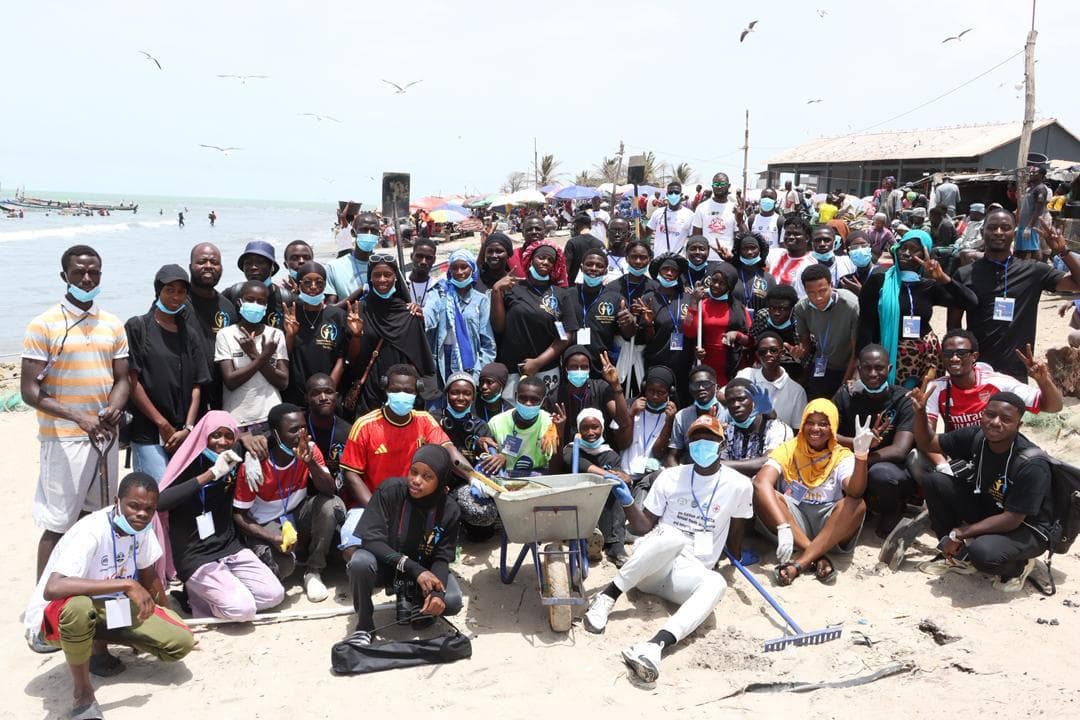 SMF community group gathered at a beach cleanup event in The Gambia